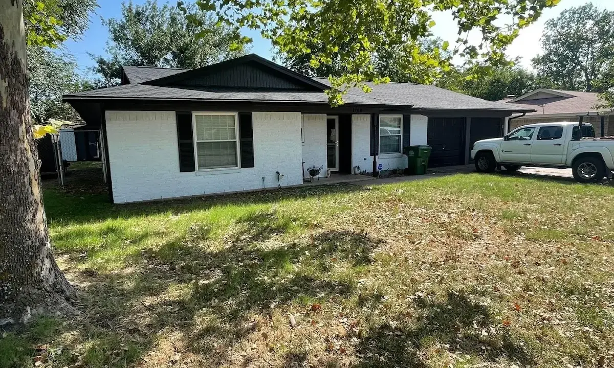 Professional roofing crew working on a residential roof in Bloomfield